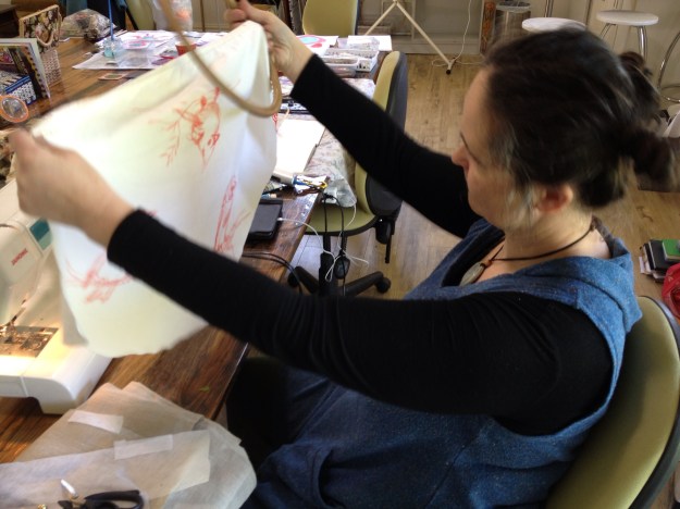 Juliet selects a bird to work on