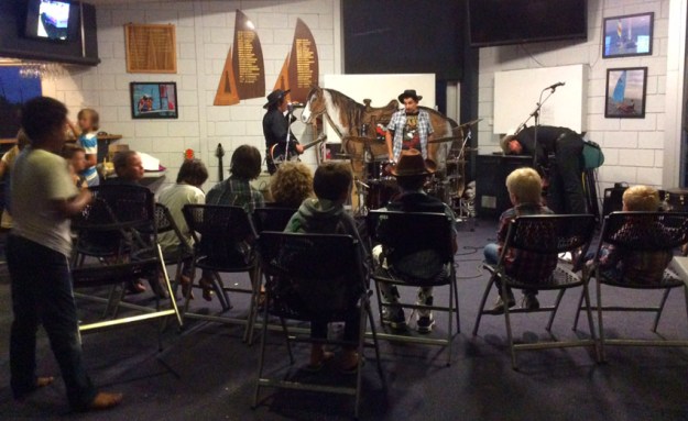 kids gather to watch band.JPG